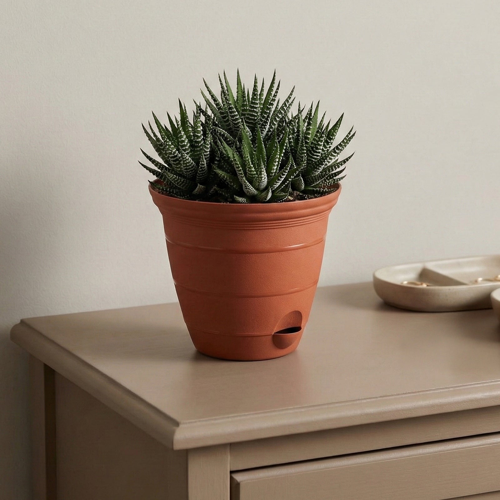Eden terracotta Roman self-watering planter for classic indoor plant décor